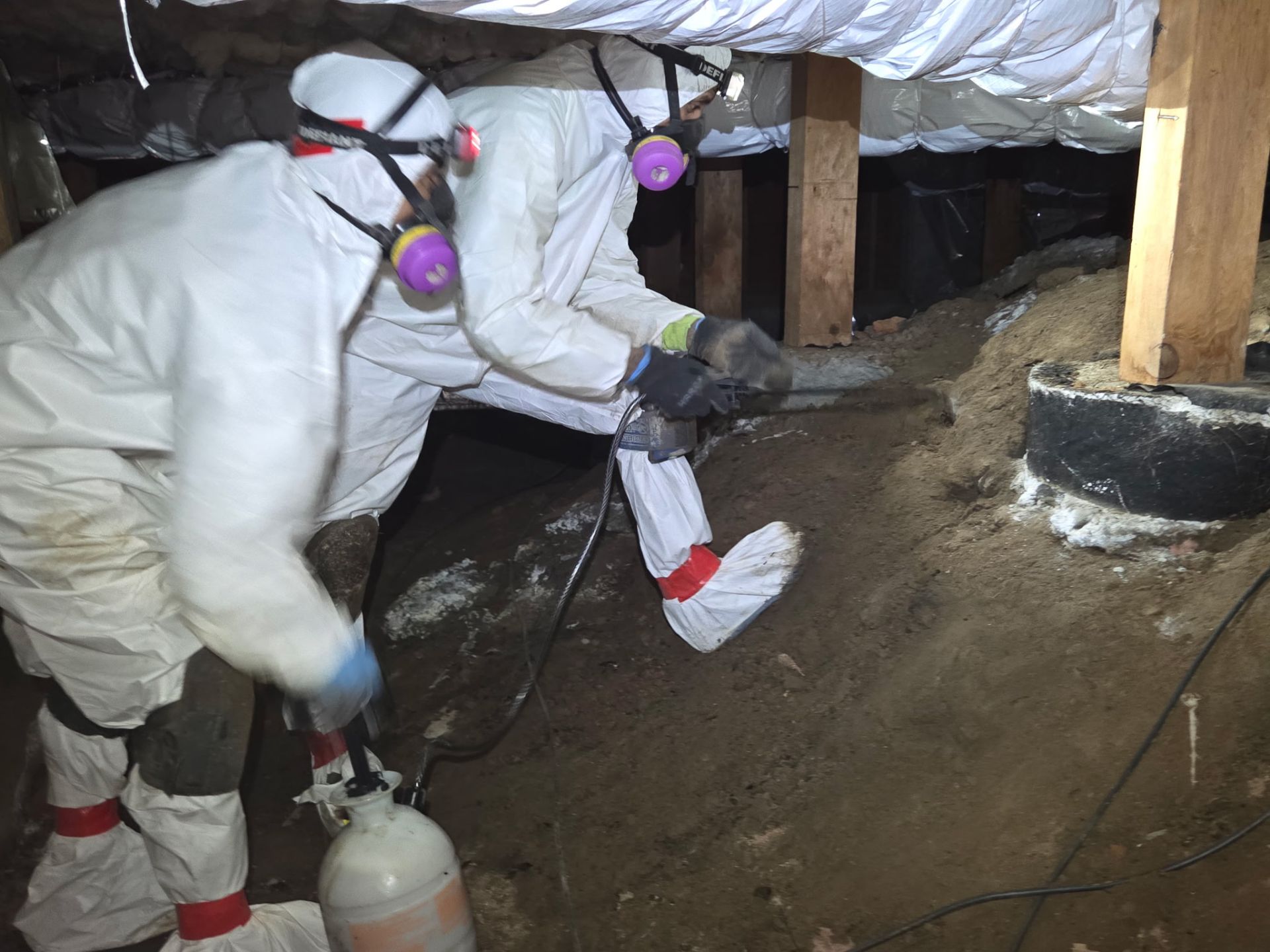 McInnis Construction crew performing environmental remediation in protective equipment