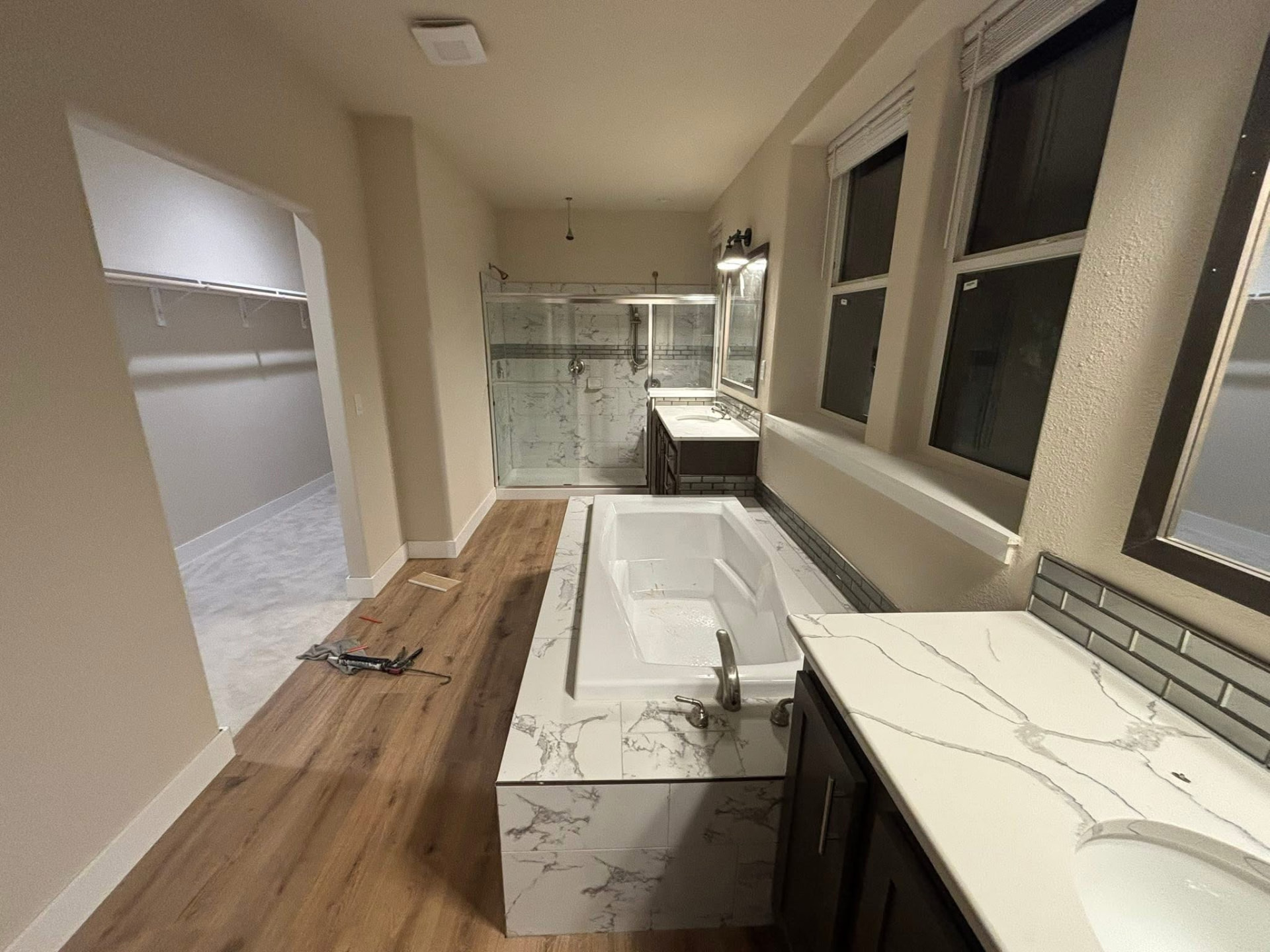 Completed bathroom project featuring coordinated plumbing, lighting and finish work